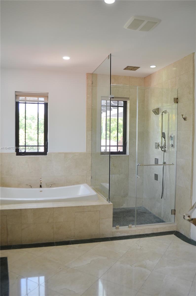 43 Southwest 20th Road Miami, FL 33129 - Photo 15 of 17 a bathroom with a bathtub and a shower
