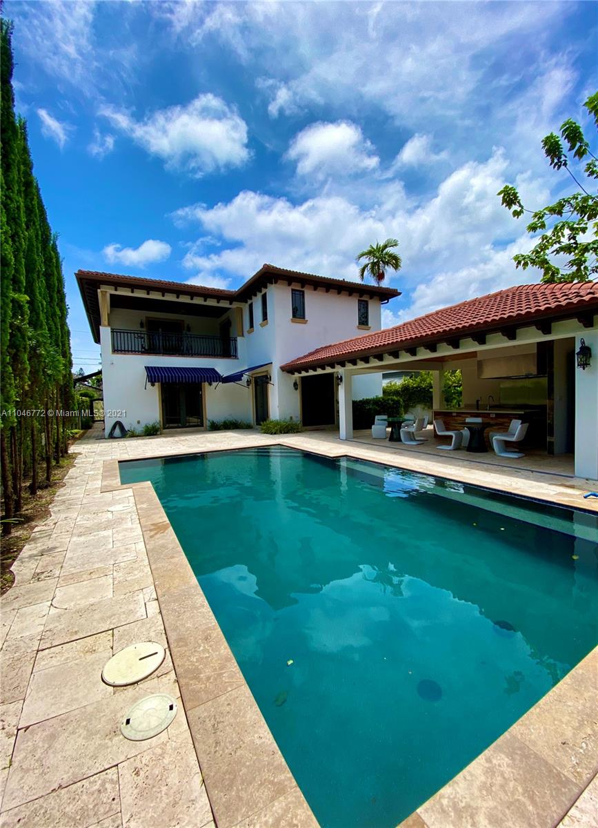 43 Southwest 20th Road Miami, FL 33129 - Photo 4 of 17 a view of house with swimming pool outdoor seating