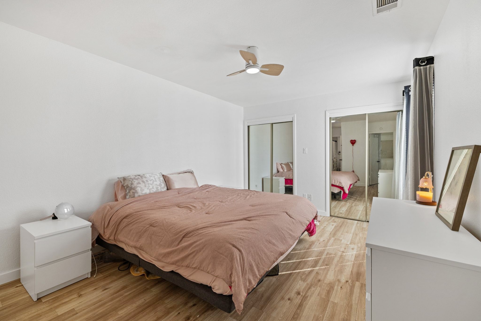 1010 West Rundberg Lane, Unit 30 Austin, TX 78758 - Photo 10 of 30 a bedroom with a bed and a couch