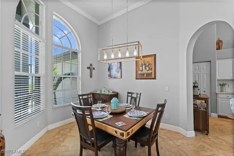 a view of a dining room with furniture and window