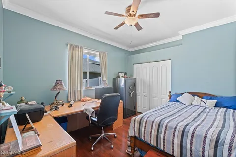 a bedroom with two beds and a chandelier