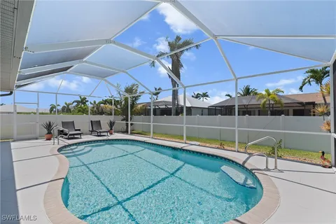 a view of a swimming pool with a patio