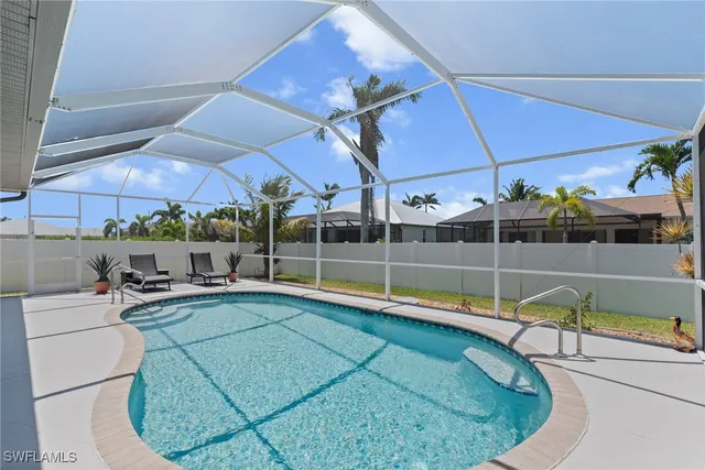 a view of a swimming pool with a patio