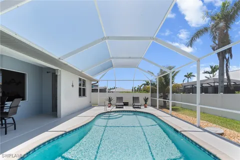 a house view with a sitting space and glass windows