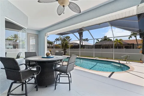 a dining room with a table and chairs