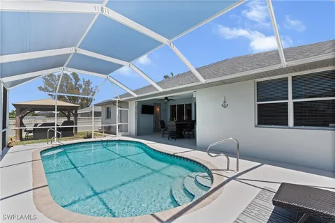 a view of a livingroom with furniture and chandelier