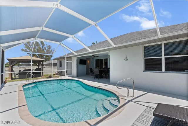 a view of a livingroom with furniture and chandelier