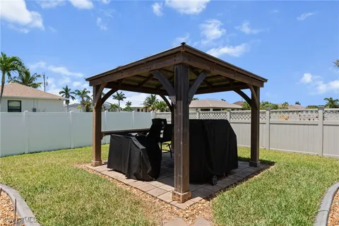 a view of backyard with cabin