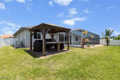 a front view of a house with yard and garage