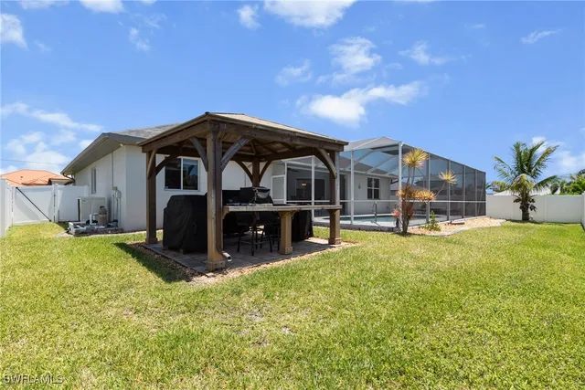 a front view of a house with yard and garage