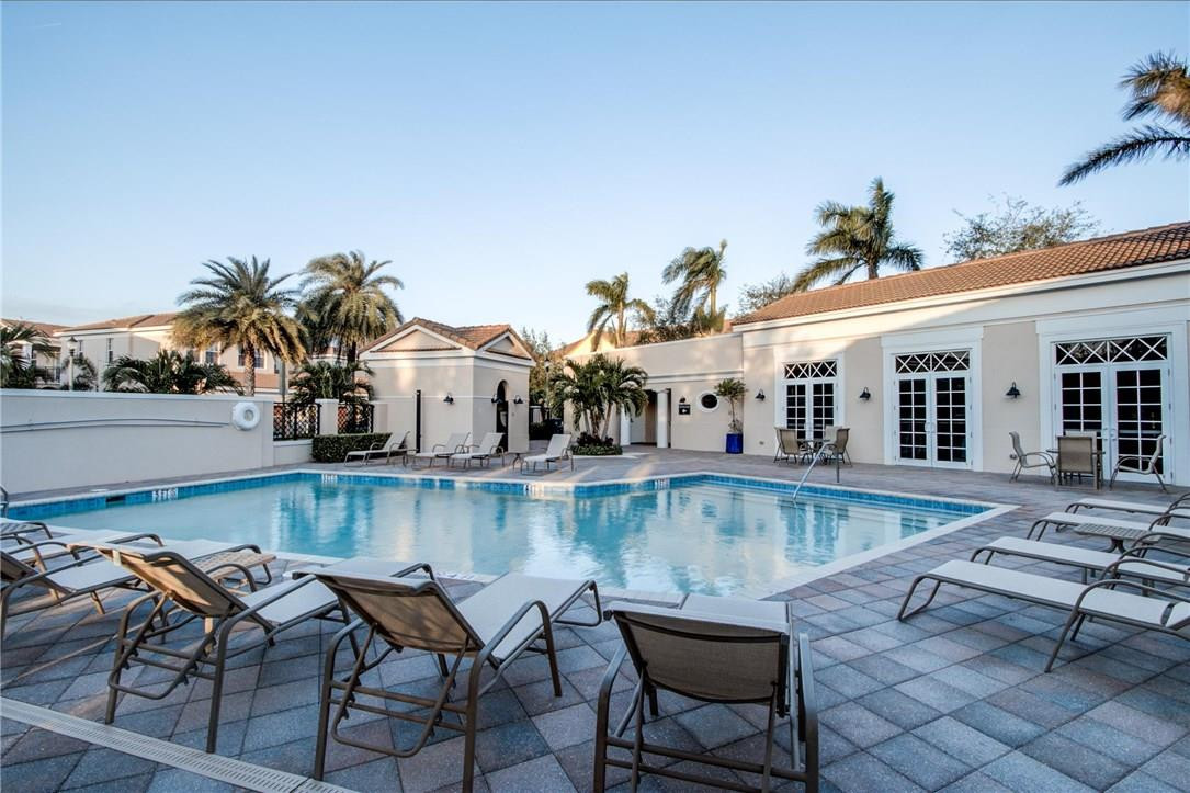 815 Northwest 82nd Place, Unit 815 Boca Raton, FL 33487 - Photo 1 of 5 a view of a swimming pool with lounge chairs