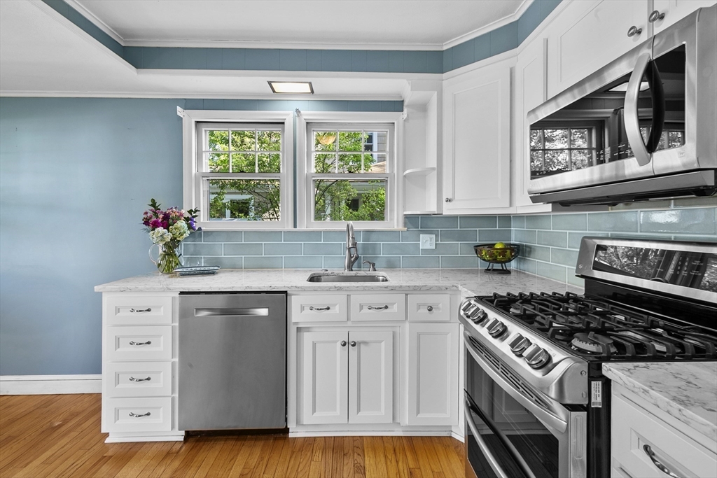 54 Chatham Road Longmeadow, MA 01106 - Photo 15 of 42 a kitchen with a sink stove and cabinets