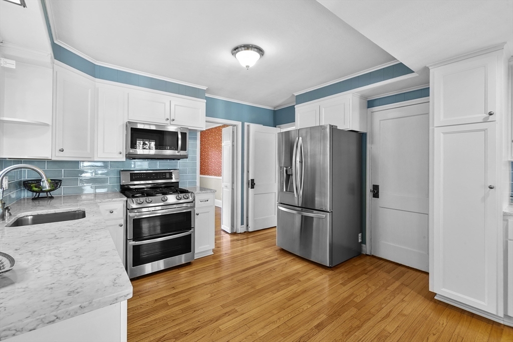 54 Chatham Road Longmeadow, MA 01106 - Photo 18 of 42 a kitchen with stainless steel appliances a refrigerator stove and microwave
