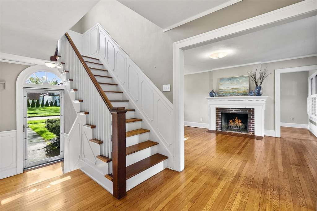 54 Chatham Road Longmeadow, MA 01106 - Photo 2 of 42 a view of an entryway with wooden floor fireplace and a kitchen