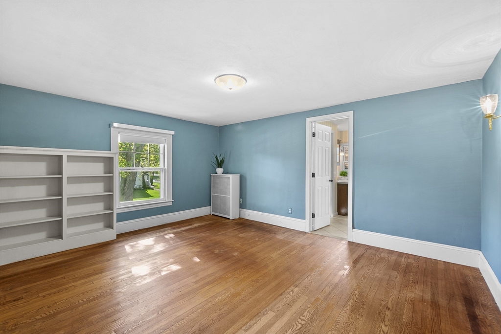 54 Chatham Road Longmeadow, MA 01106 - Photo 23 of 42 a view of an empty room with a window and wooden floor