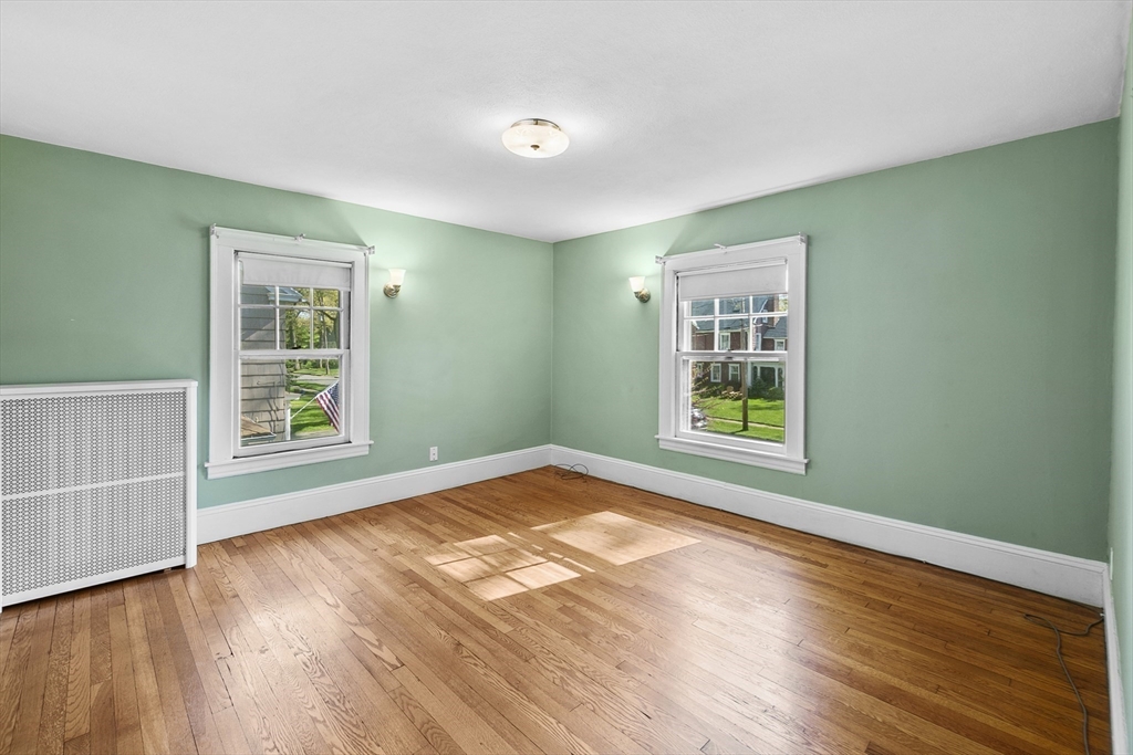 54 Chatham Road Longmeadow, MA 01106 - Photo 28 of 42 a view of an empty room with wooden floor and a window