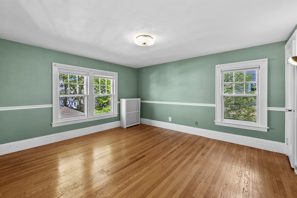 54 Chatham Road Longmeadow, MA 01106 - Photo 31 of 42 a view of an empty room with a window and wooden floor