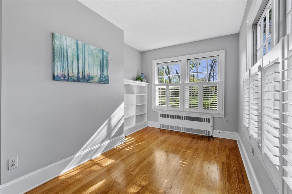 54 Chatham Road Longmeadow, MA 01106 - Photo 8 of 42 a view of an empty room with a window and wooden floor