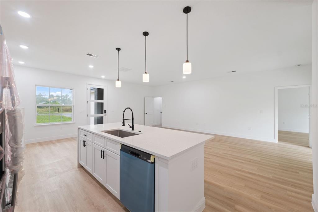 15775 Southwest 46th Circle Ocala, FL 34473 - Photo 12 of 35 a kitchen with a sink and a wooden floor