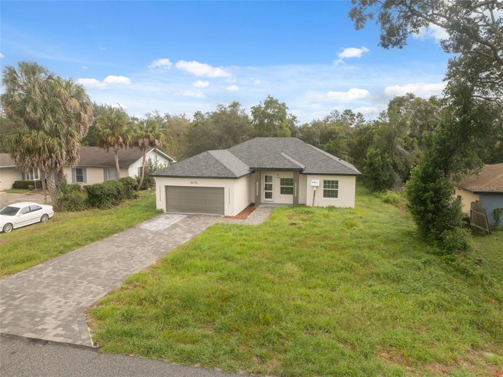 15775 Southwest 46th Circle Ocala, FL 34473 - Photo 34 of 35 a front view of a house with a yard