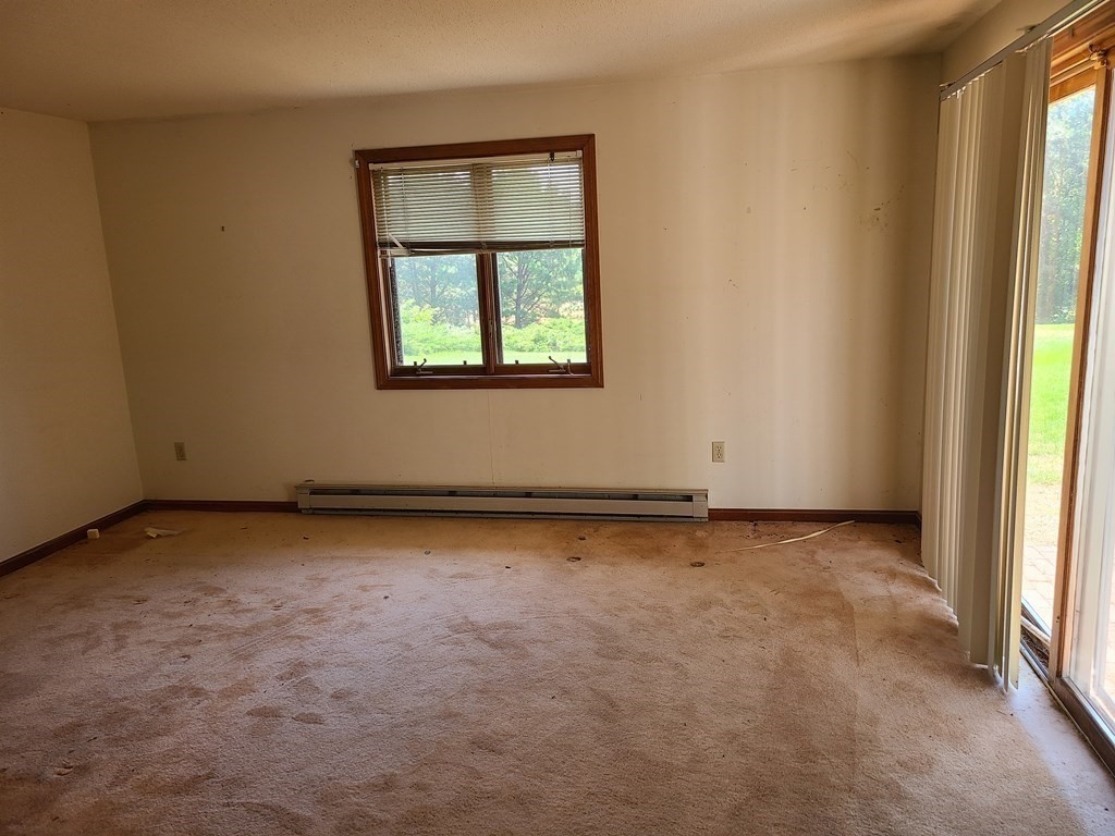 174 Lowell Road, Unit 62 Mashpee, MA 02649 - Photo 23 of 30 an empty room with a window