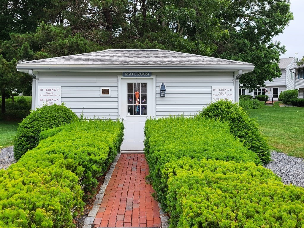 174 Lowell Road, Unit 62 Mashpee, MA 02649 - Photo 7 of 30 a aerial view of a house with yard and plants