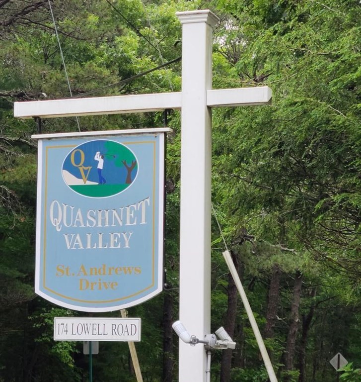 174 Lowell Road, Unit 62 Mashpee, MA 02649 - Photo 10 of 30 a sign on the side of a building