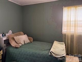 111 Magnolia Lane Lancaster, SC 29720 - Photo 4 of 8 a bed room with a bed and a window