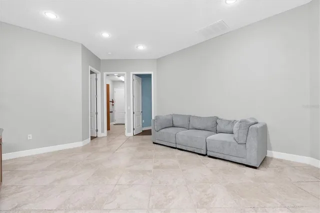 a view of a dining room with furniture and window