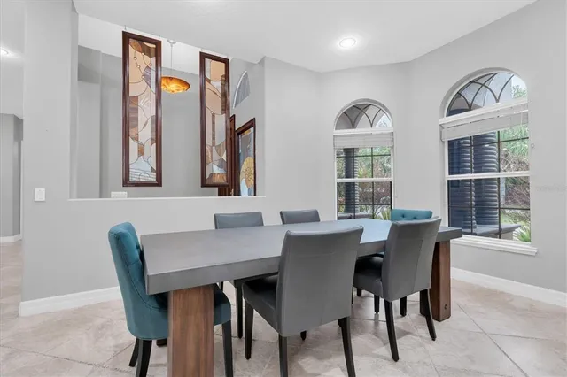 a bathroom with a granite countertop sink a toilet a mirror and shower