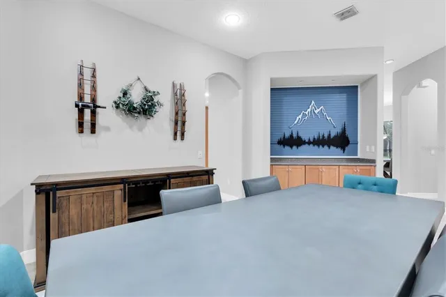 a view of a livingroom with a ceiling fan and a window