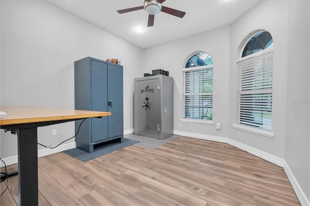 a view of walk in closet with empty racks