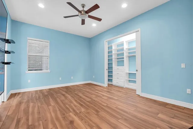 a view of a field with a tree in the background