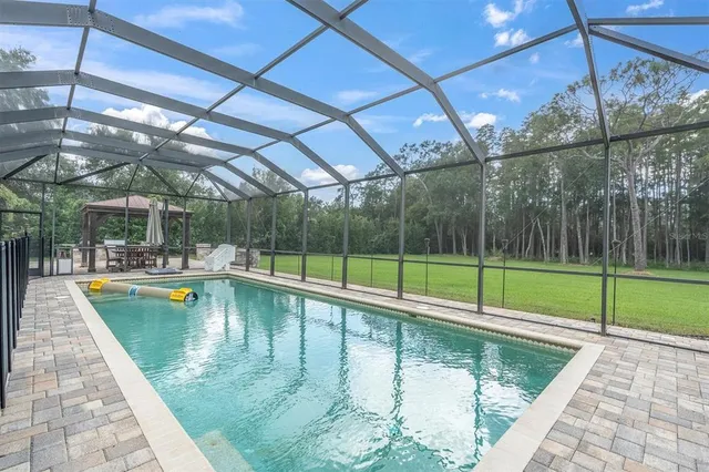 a kitchen with stainless steel appliances a refrigerator sink and cabinets