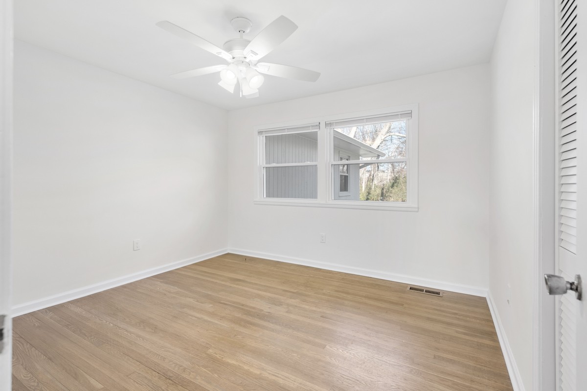 201 Porter Circle Columbia, TN 38401 - Photo 23 of 30 an empty room with wooden floor and windows
