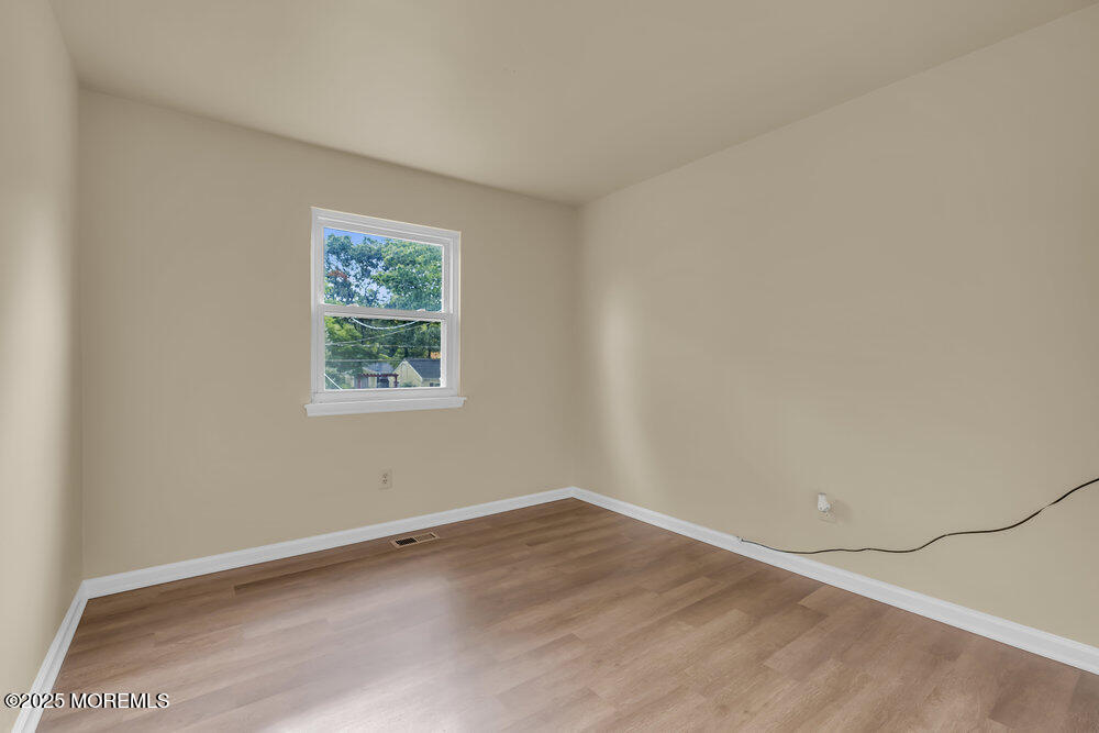 32 Pine Tree Drive Bayville, NJ 08721 - Photo 12 of 63 an empty room with a window