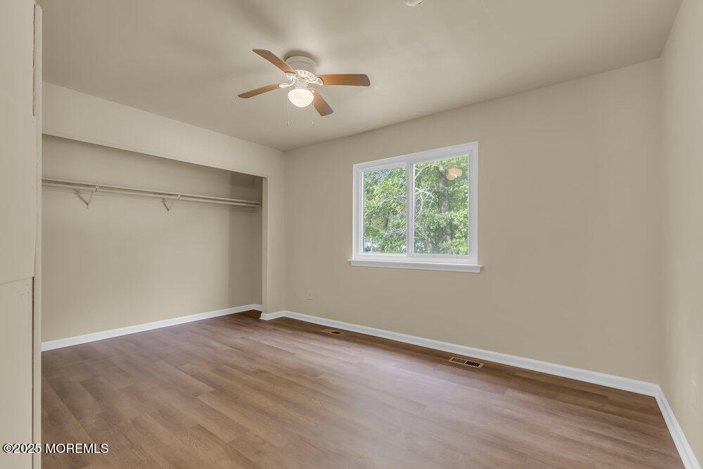 32 Pine Tree Drive Bayville, NJ 08721 - Photo 14 of 63 an empty room with a window