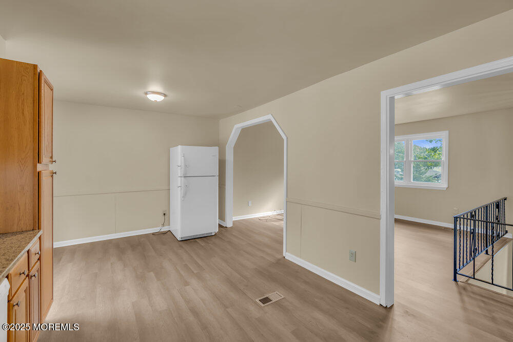 32 Pine Tree Drive Bayville, NJ 08721 - Photo 21 of 63 wooden floor in an empty room with a window