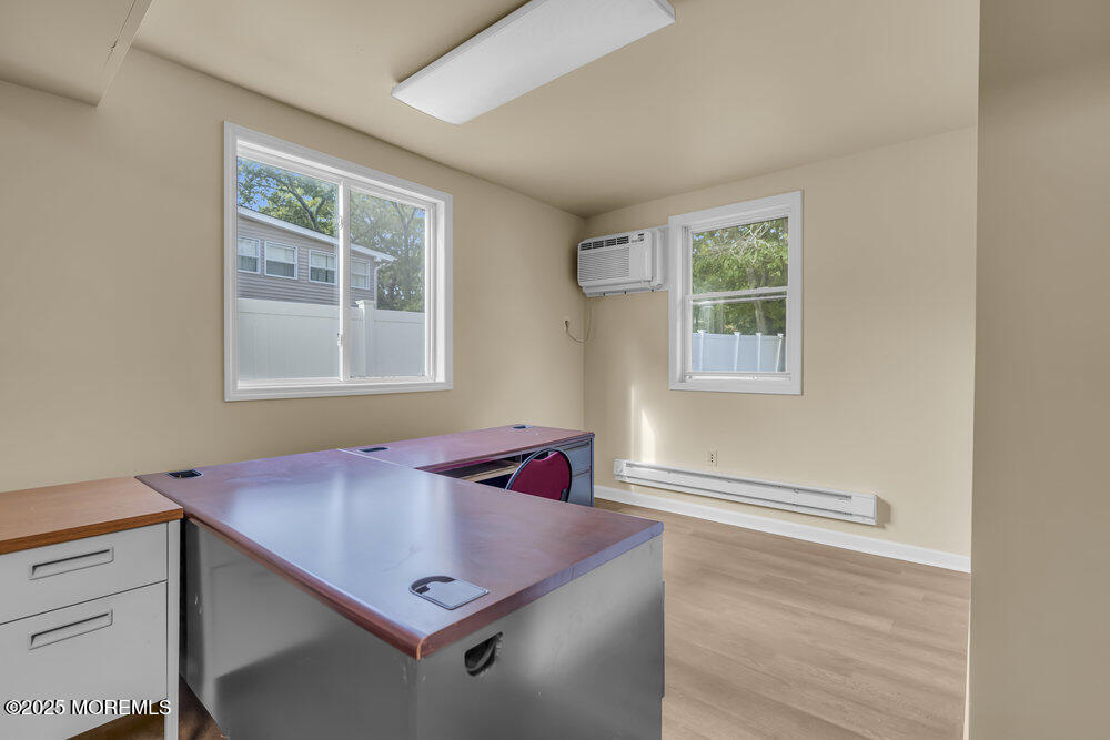 32 Pine Tree Drive Bayville, NJ 08721 - Photo 23 of 63 a view of a workspace with furniture and a window