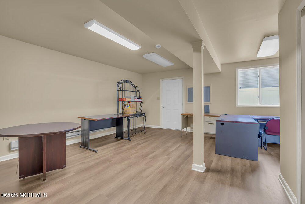 32 Pine Tree Drive Bayville, NJ 08721 - Photo 24 of 63 a living room with furniture and a wooden floor