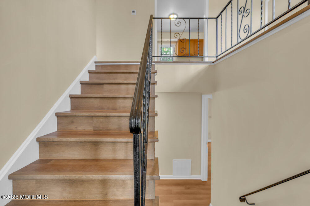 32 Pine Tree Drive Bayville, NJ 08721 - Photo 3 of 63 a view of staircase with white walls and a window