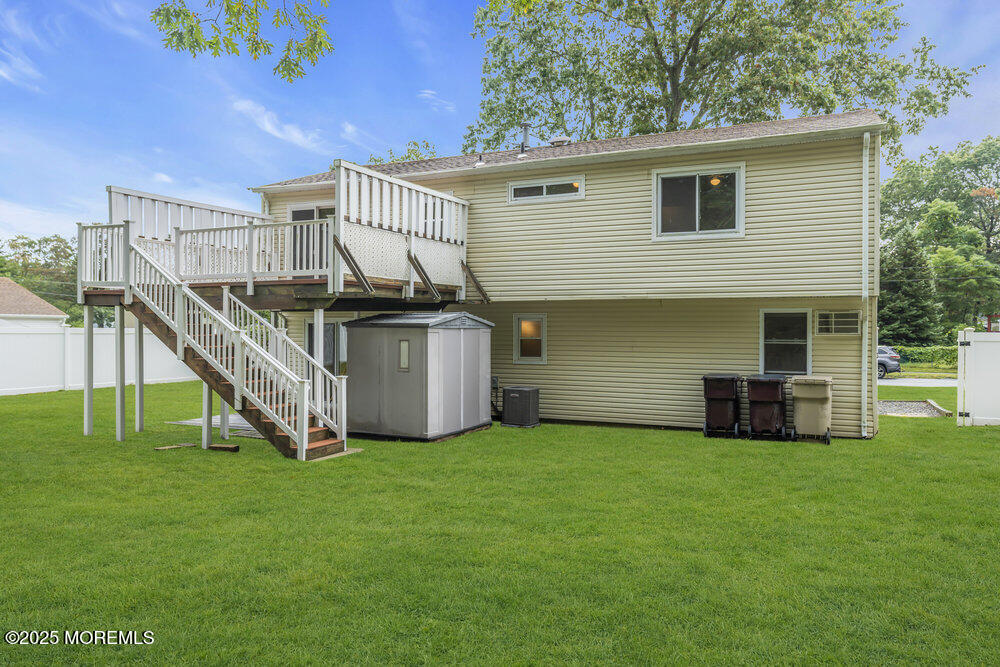 32 Pine Tree Drive Bayville, NJ 08721 - Photo 39 of 63 a view of a house with a yard and sitting area