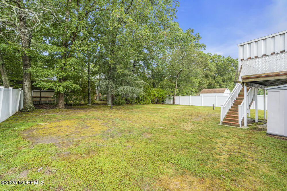 32 Pine Tree Drive Bayville, NJ 08721 - Photo 48 of 63 a view of a swimming pool with an outdoor space