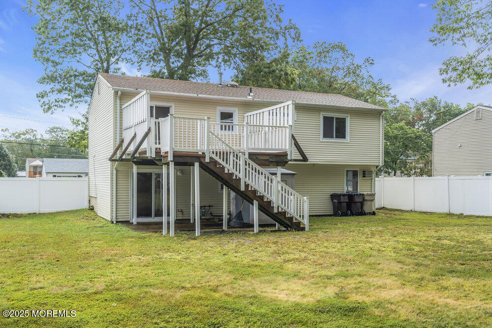 32 Pine Tree Drive Bayville, NJ 08721 - Photo 51 of 63 a view of a house with pool and a yard