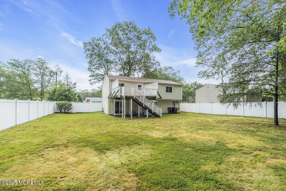 32 Pine Tree Drive Bayville, NJ 08721 - Photo 53 of 63 a view of a house with a yard and garage