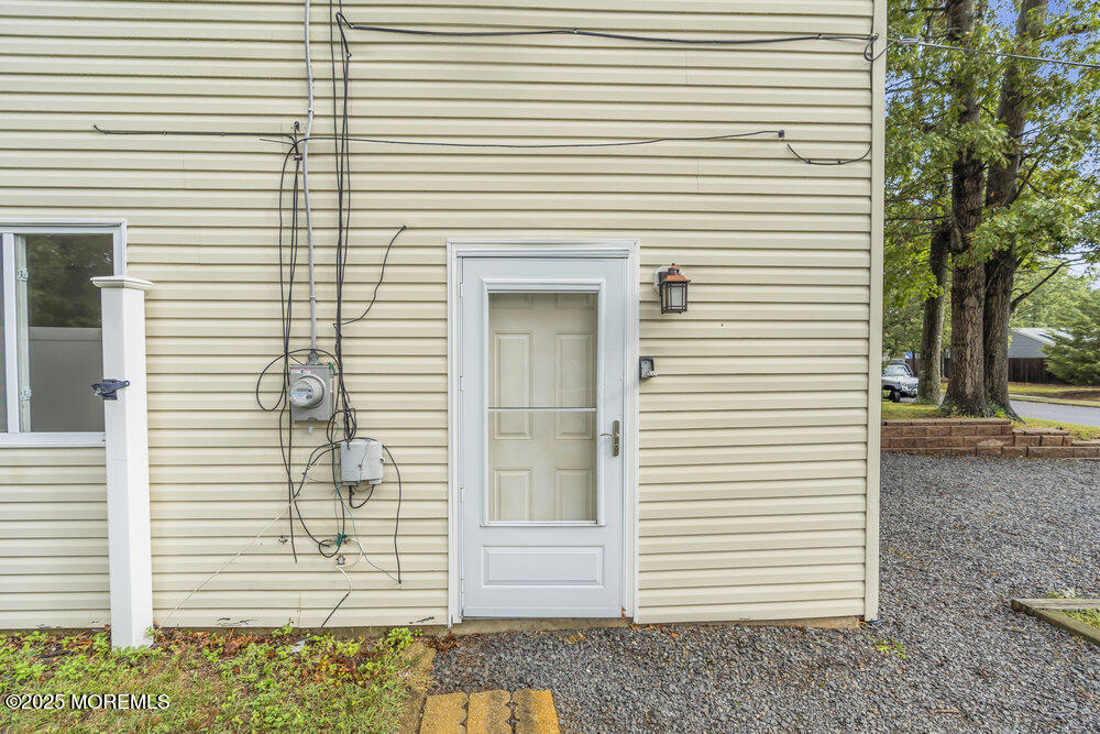 32 Pine Tree Drive Bayville, NJ 08721 - Photo 56 of 63 a view of a house with a white door