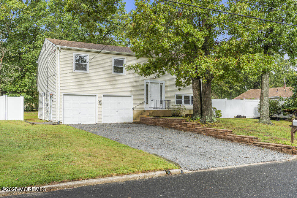 32 Pine Tree Drive Bayville, NJ 08721 - Photo 57 of 63 a view of a house with a yard and large tree