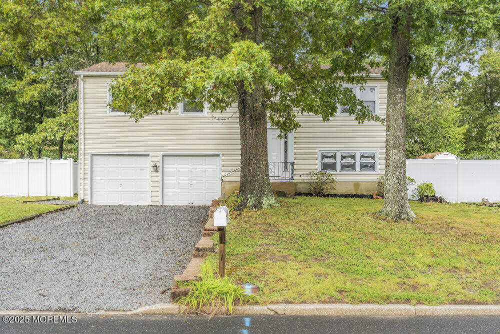 32 Pine Tree Drive Bayville, NJ 08721 - Photo 58 of 63 a house with a yard and large trees