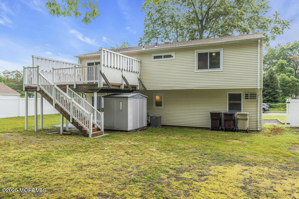 32 Pine Tree Drive Bayville, NJ 08721 - Photo 59 of 63 a view of a house with a yard
