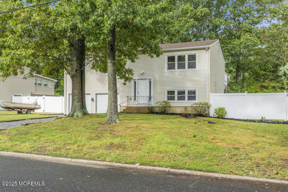32 Pine Tree Drive Bayville, NJ 08721 - Photo 61 of 63 a front view of a house with a yard